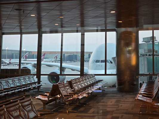 Passenger plane viewed from the seating area at Hamad International Airport in Doha
