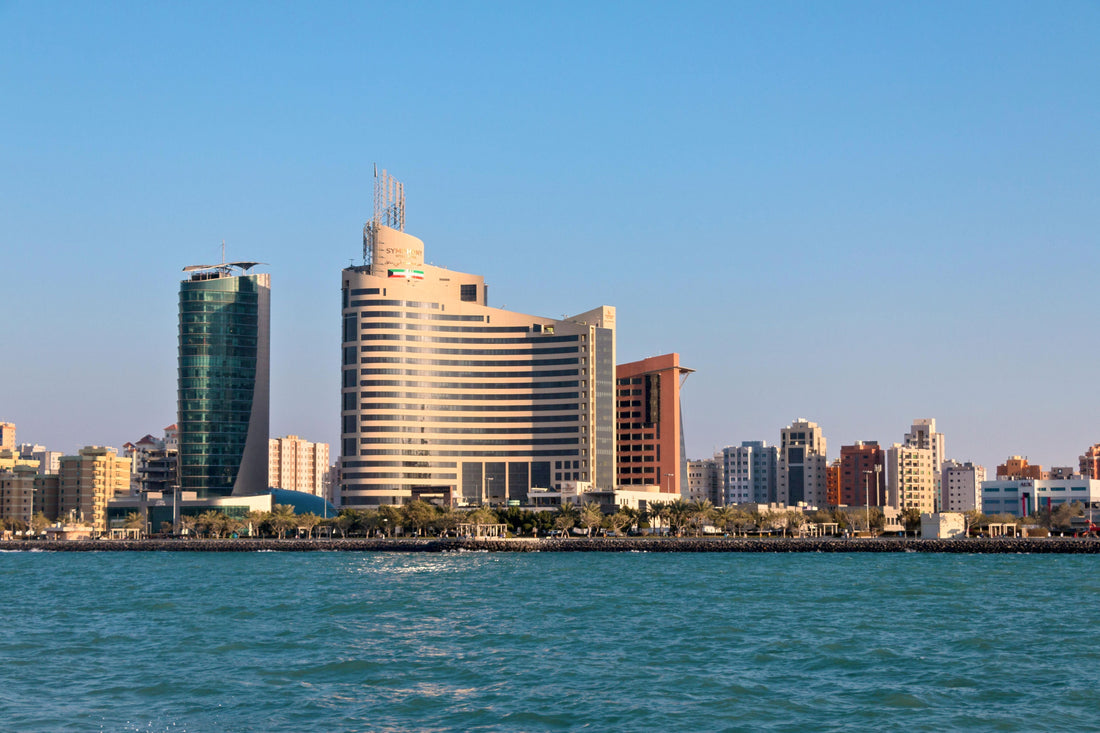Kuwait City skyline and waterfront under a clear sky