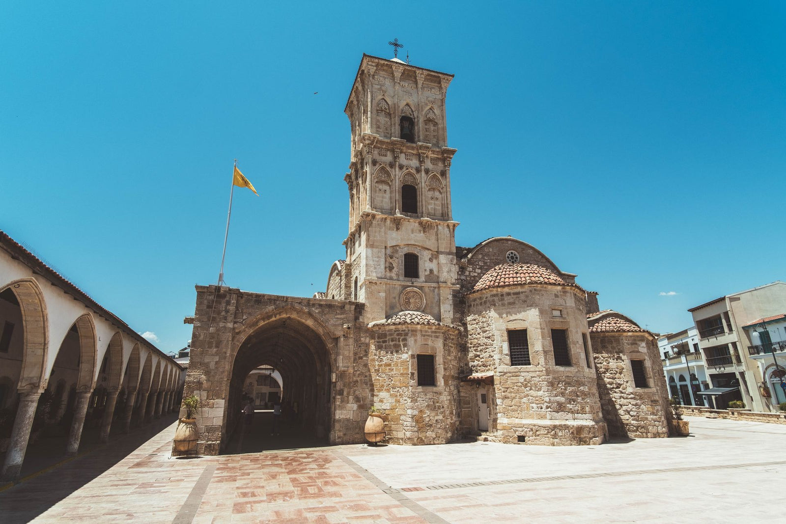 Beautiful historic church in Larnaca, Cyprus with clear blue sky, showcasing stunning Mediterranean architecture.