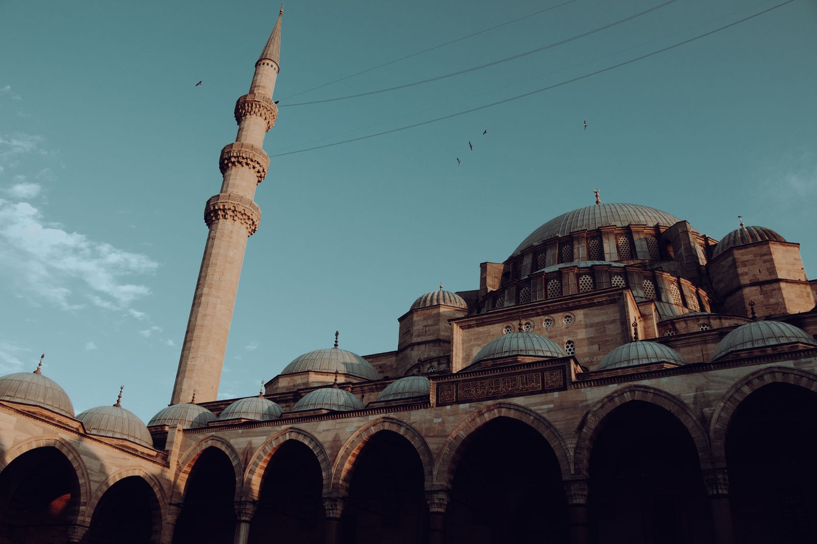 Captivating view of the Suleymaniye Mosque and minaret against a clear sky in Istanbul, Turkey.