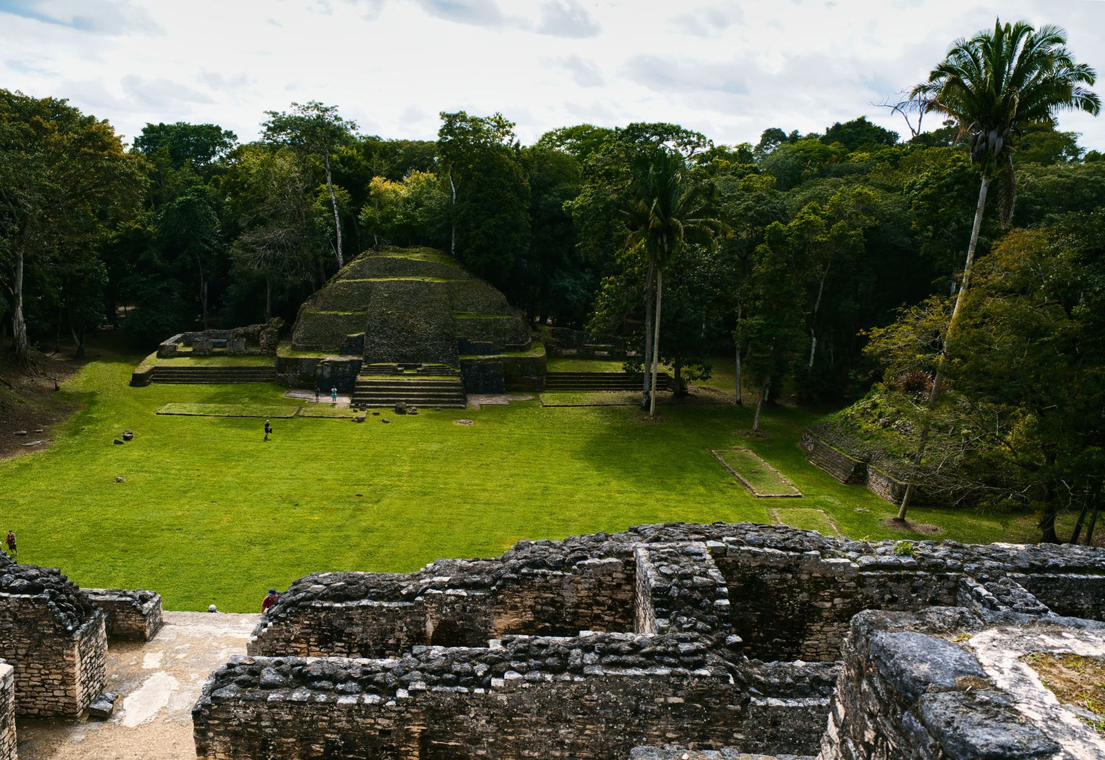 Explore the ancient Mayan ruins at Xunantunich surrounded by lush Belizean jungle.