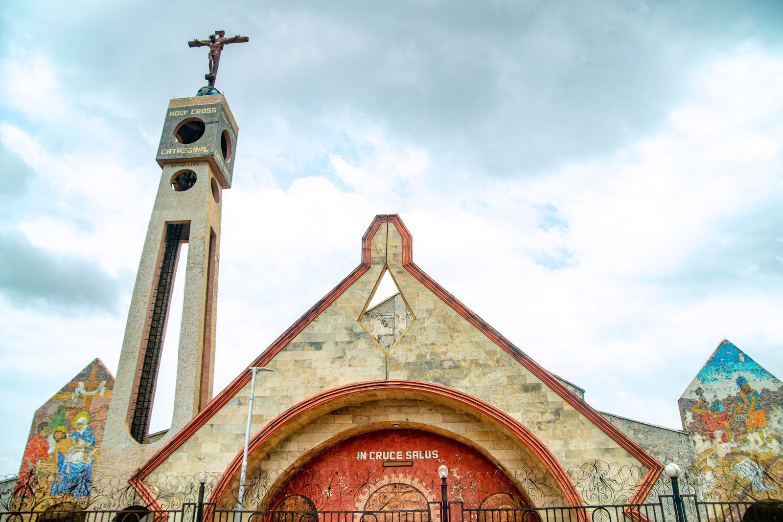 Stunning view of Holy Cross Cathedral, Benin City, showcasing its architectural design and murals.