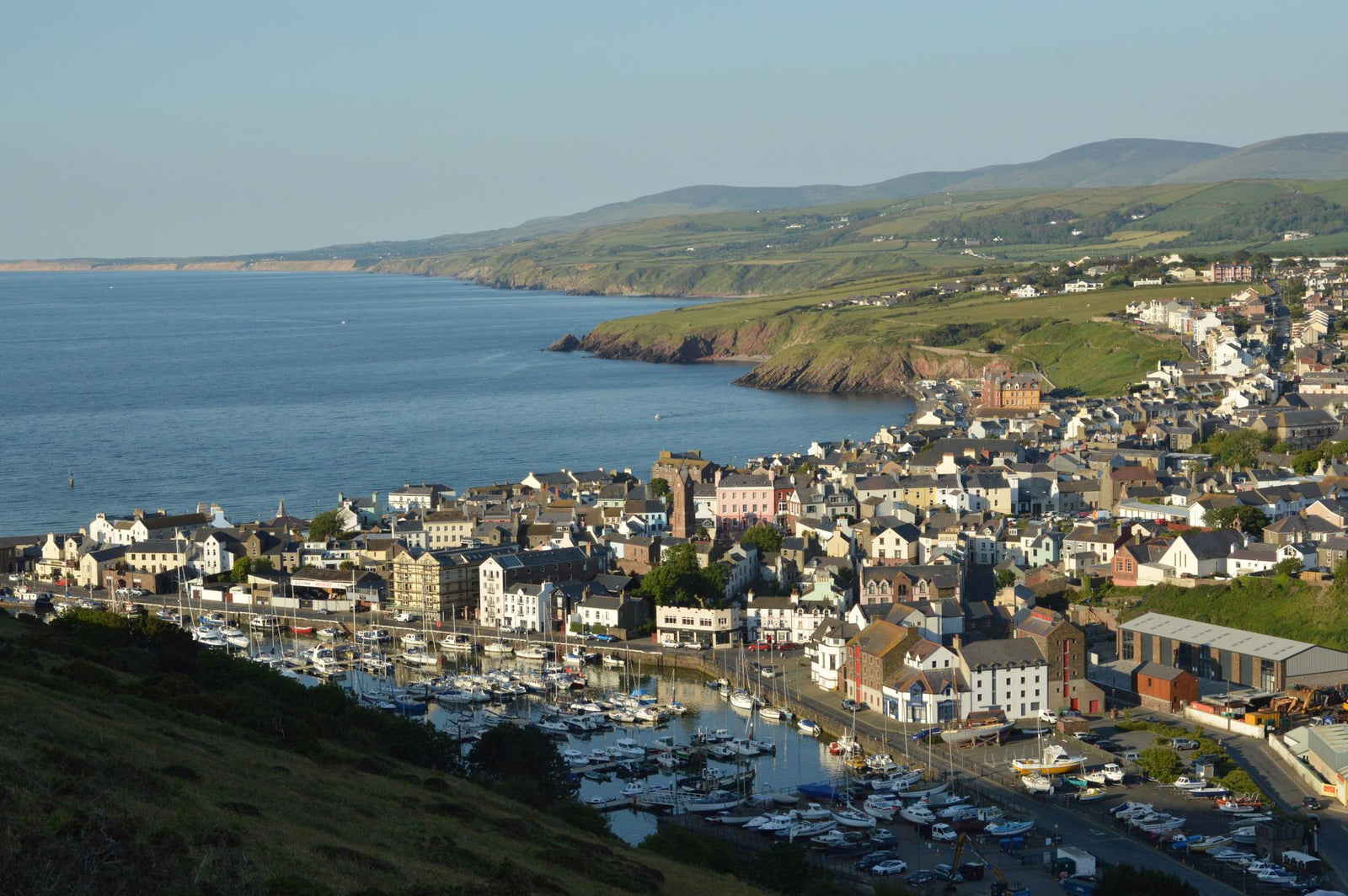 A picturesque view of Peel marina and town on the Isle of Man, showcasing the coastline.
