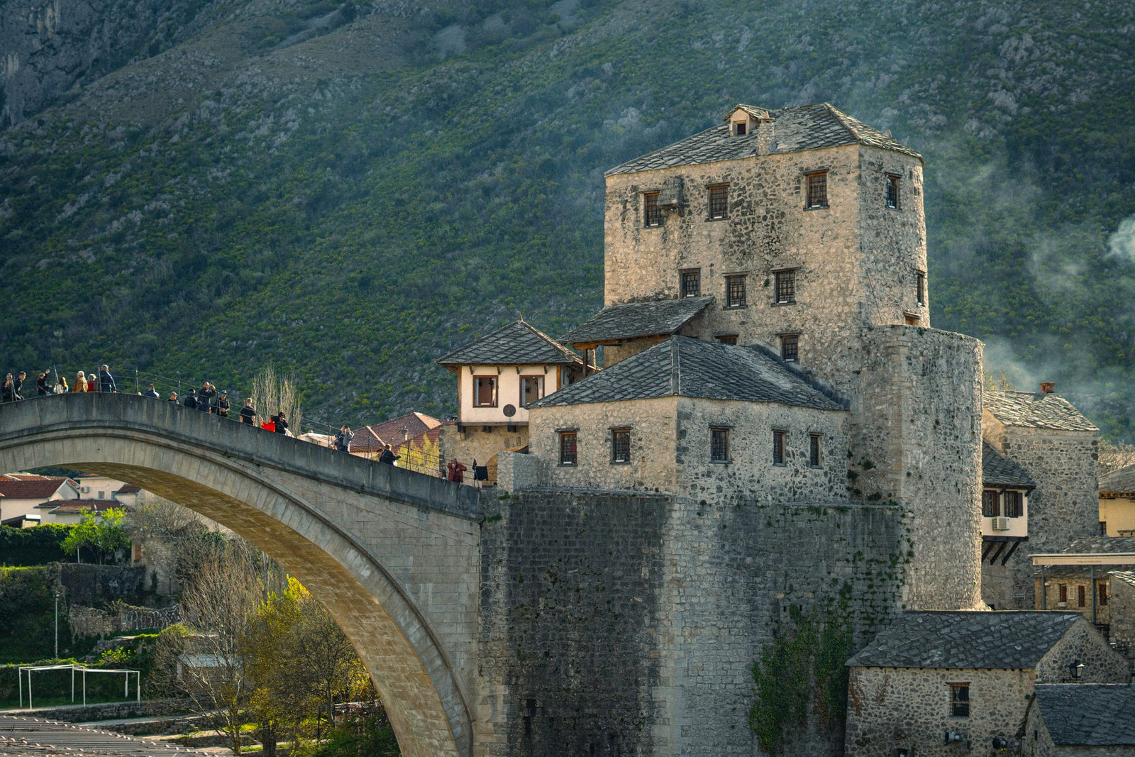 View of the iconic Stari Most bridge and historical architecture in Mostar, Bosnia and Herzegovina.