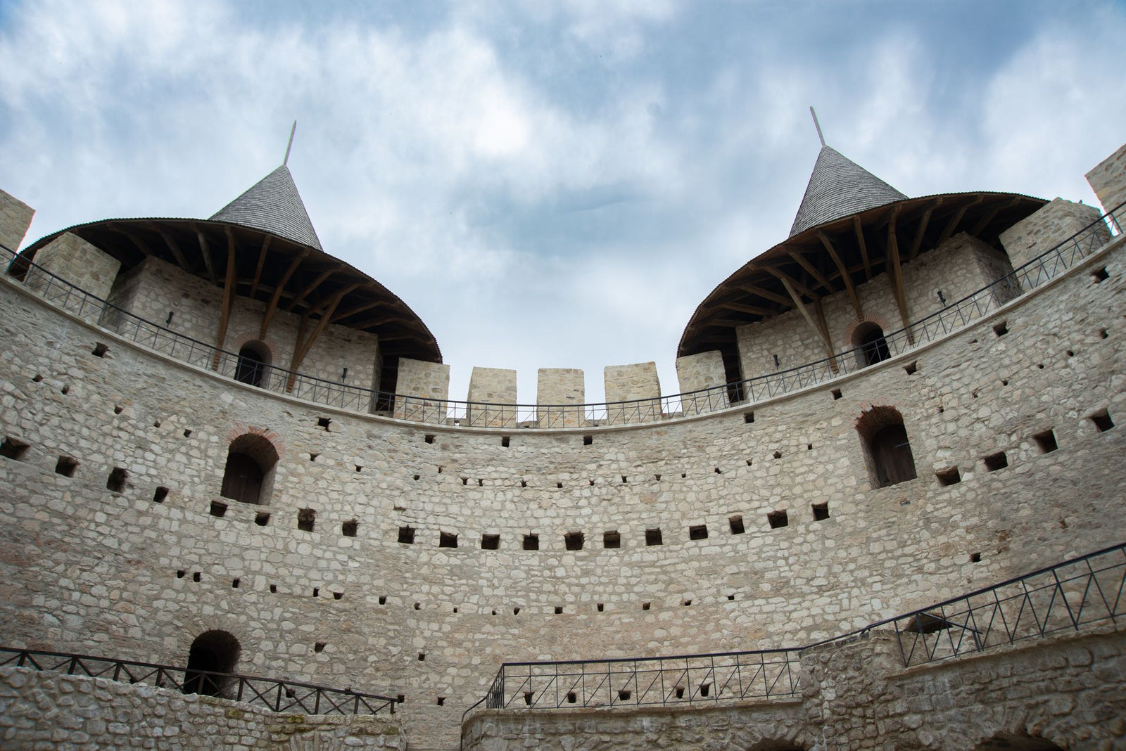 Captivating view of Soroca Fortress, featuring iconic towers against a cloudy sky.