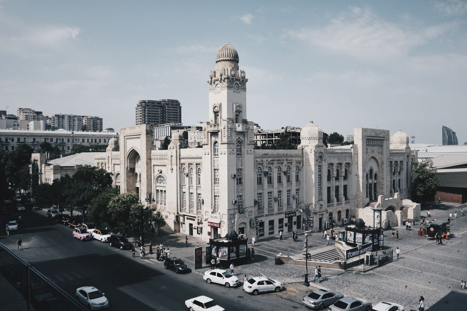 Discover the architectural charm of Baku Railway Station in this lively urban scene.