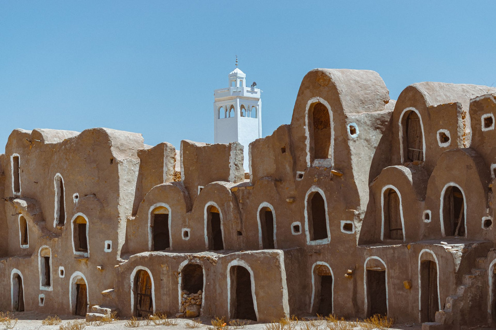 Discover ancient Ksour architecture in the sunlit landscapes of Tataouine, Tunisia.