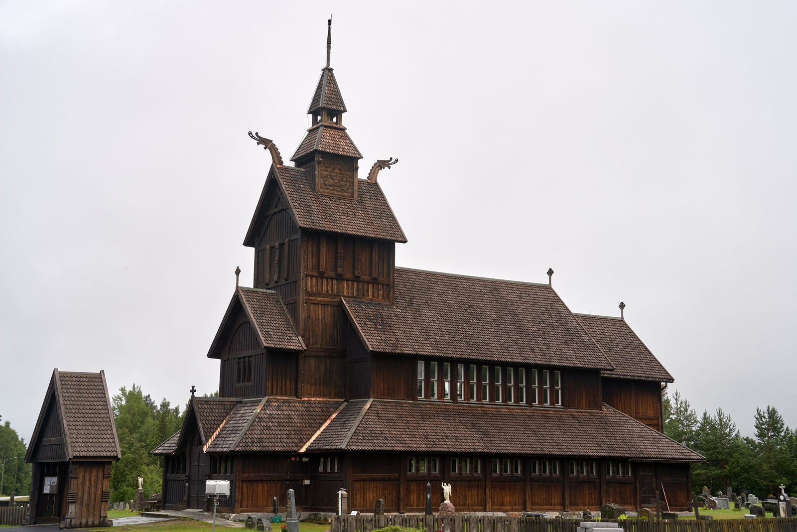 Historic Uvdal Stave Church in Uvdal, Norway, exemplifies medieval architecture amidst a serene winter landscape.
