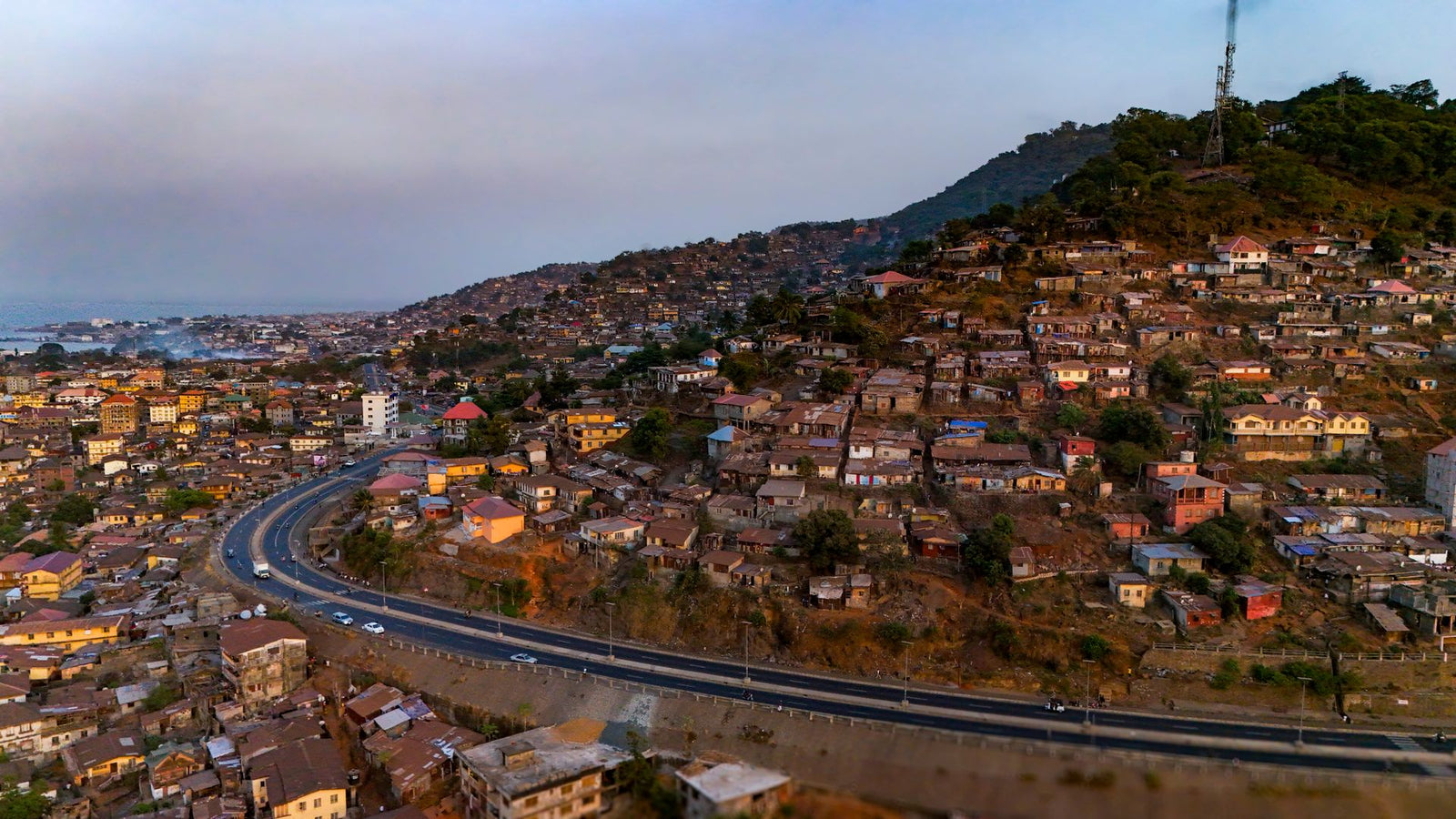 Aerial photograph showcasing the scenic hillside housing of Freetown, Sierra Leone during daytime.