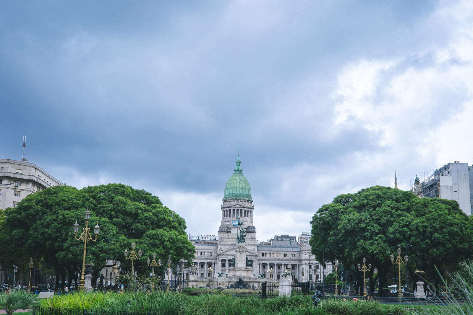 View of the iconic National Congress Building in Buenos Aires with cloudy sky.