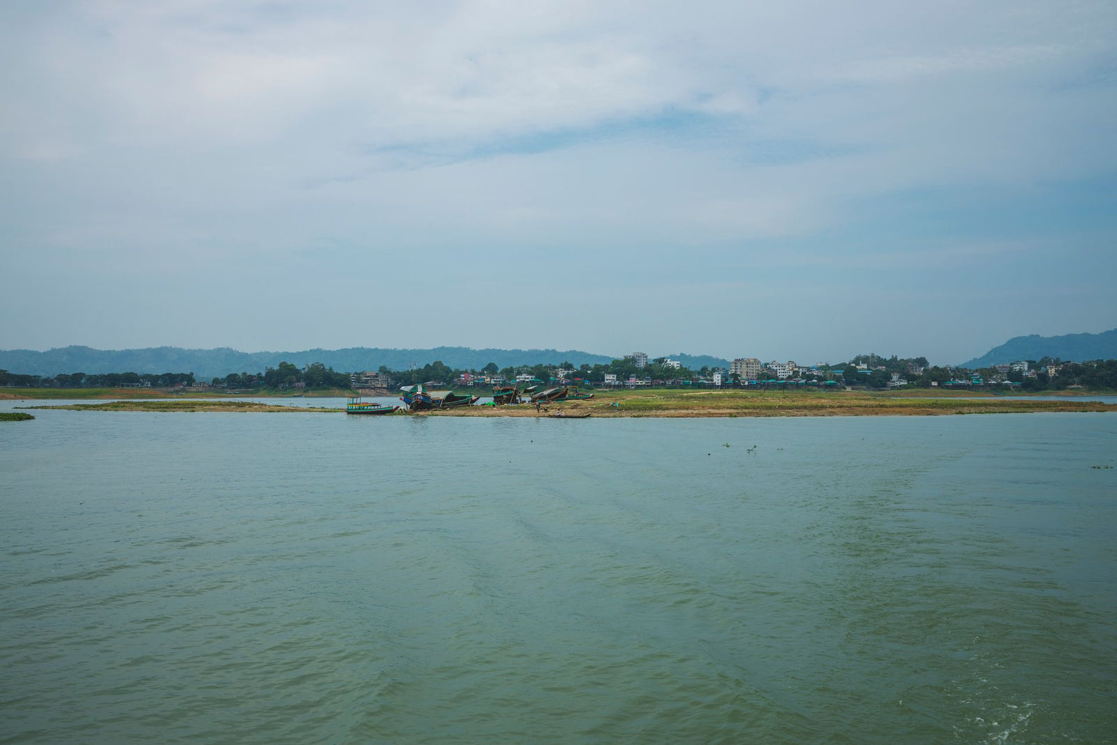 Riverside village and mountains — Asia