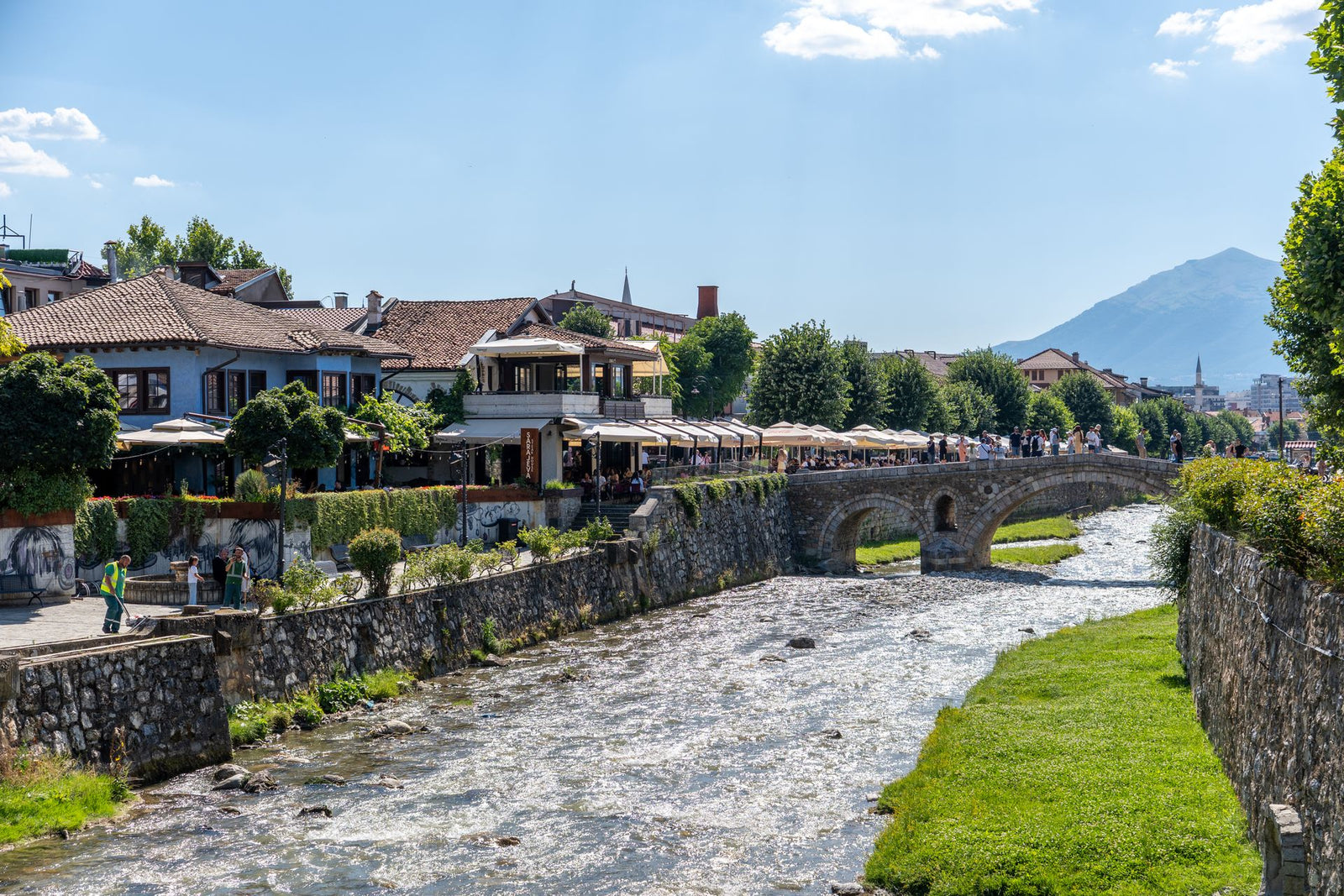 Stone bridge over the Prizren river with the old town and mountains, Kosovo