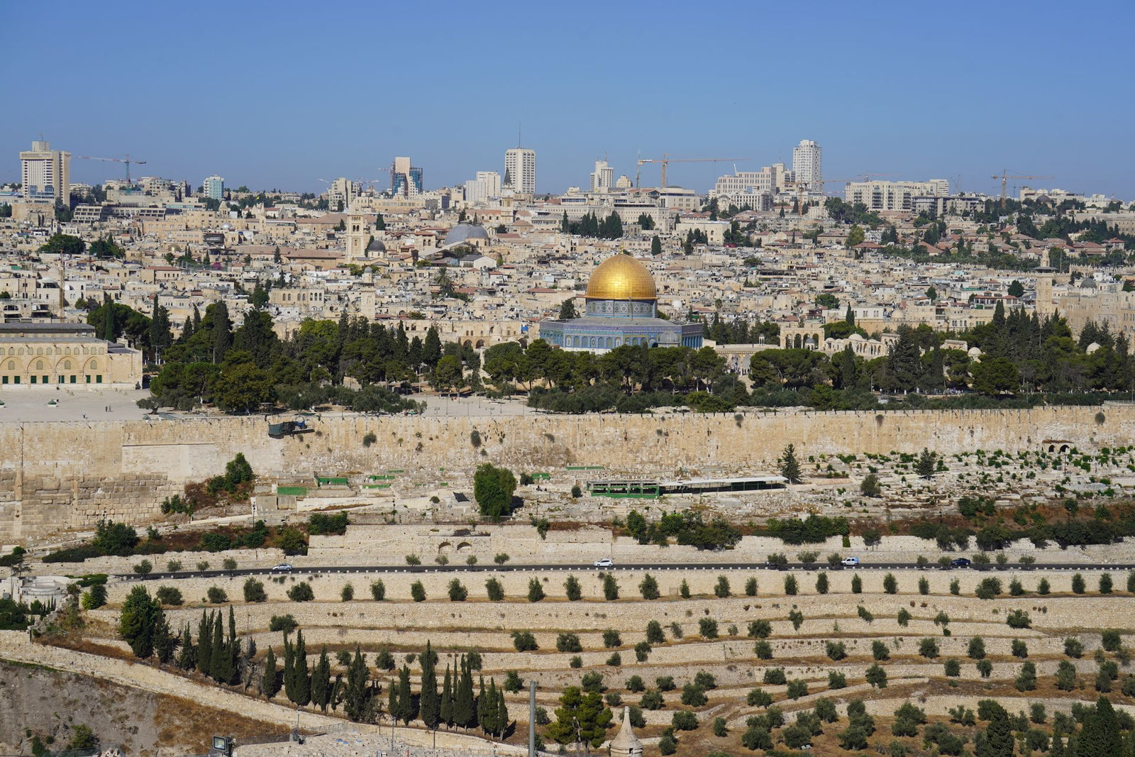 Breathtaking aerial cityscape of Jerusalem featuring the iconic Dome of the Rock.